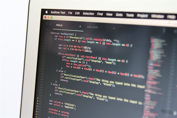 A laptop screen showing code