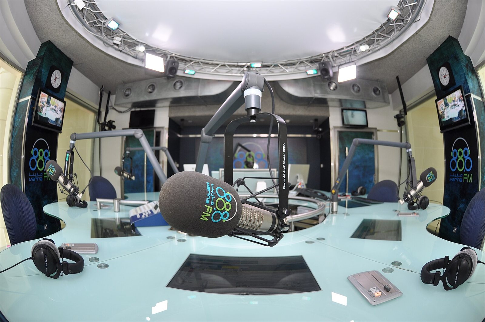 A radio studio with a broadcast desk and microphone