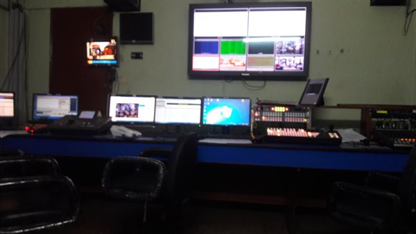 The master control room of a television channel, with rows of monitors