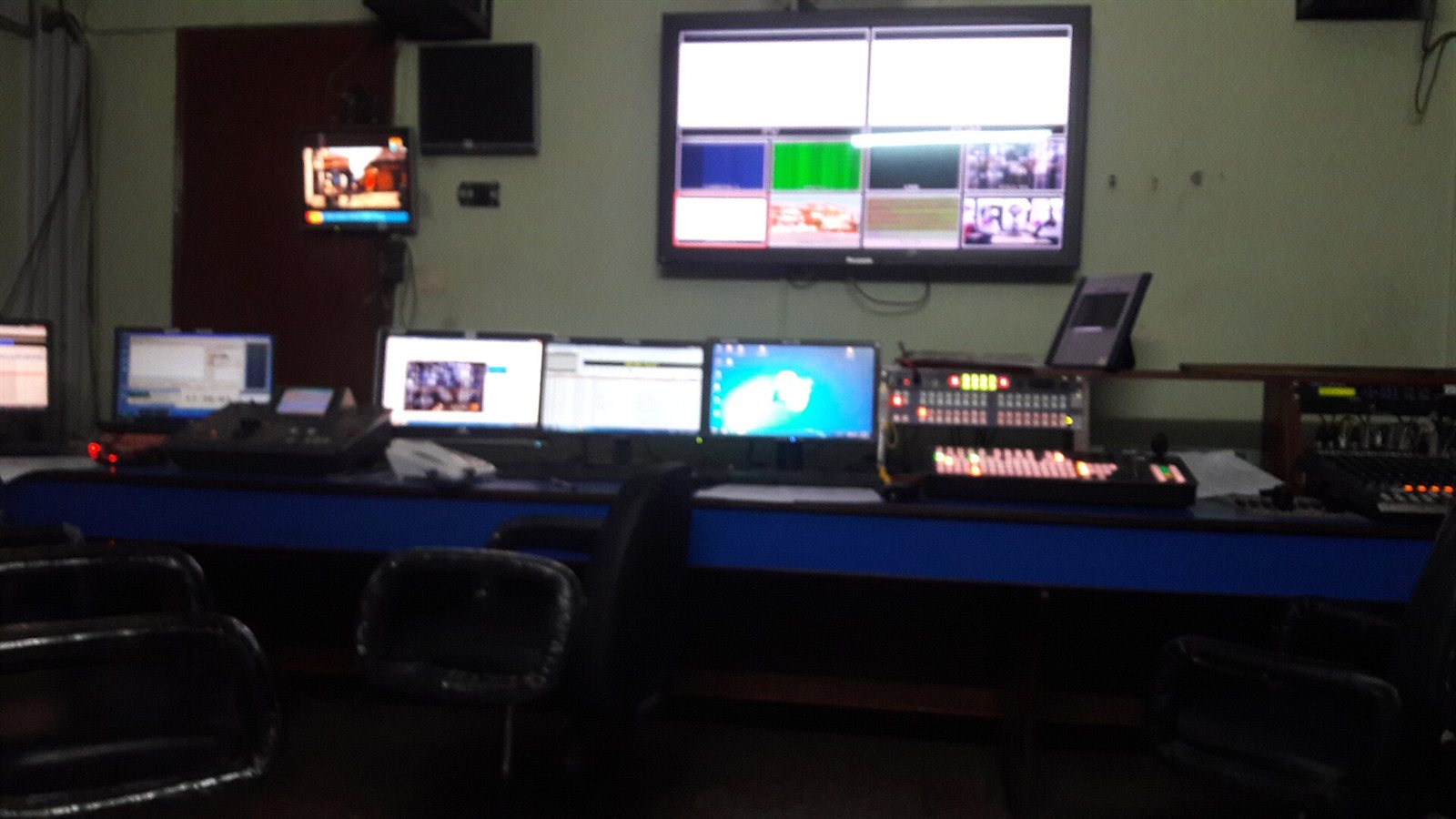 The master control room of a television channel, with rows of monitors