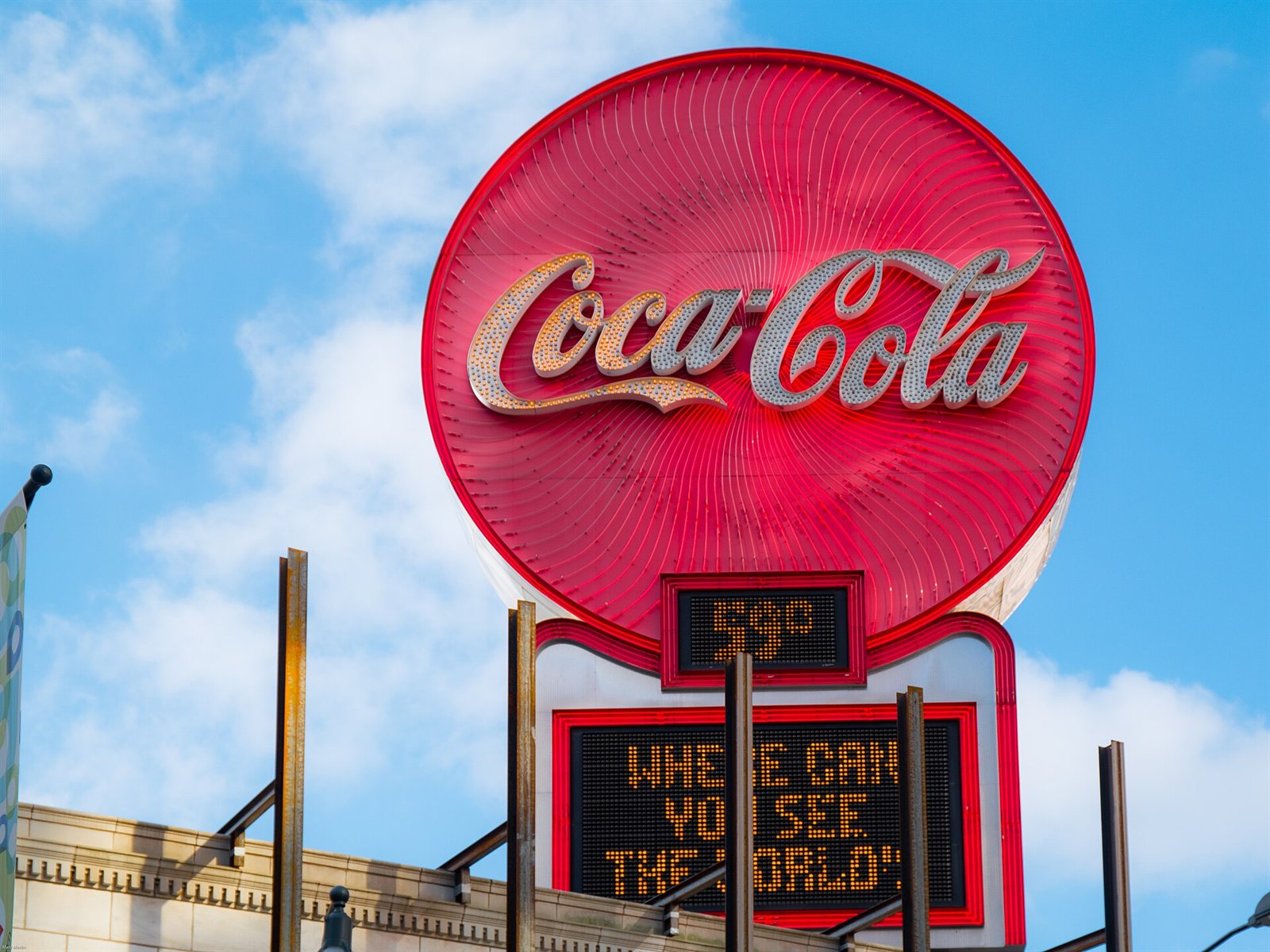 A red neon Coca-Cola sign on top of the Olympia Building in Five Points, Atlanta