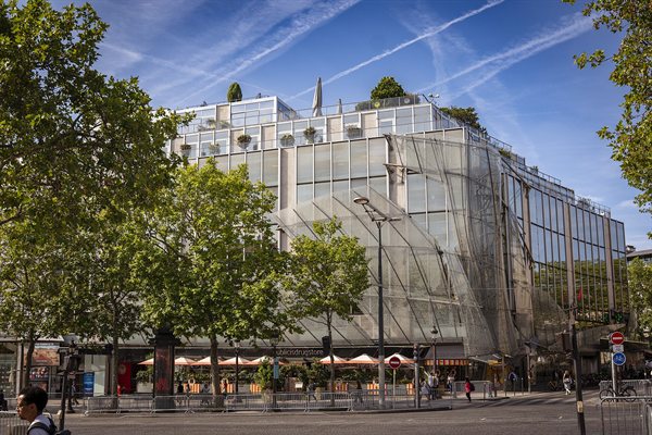 The glass façade of the Publicis building on the Champs-Élysées in Paris